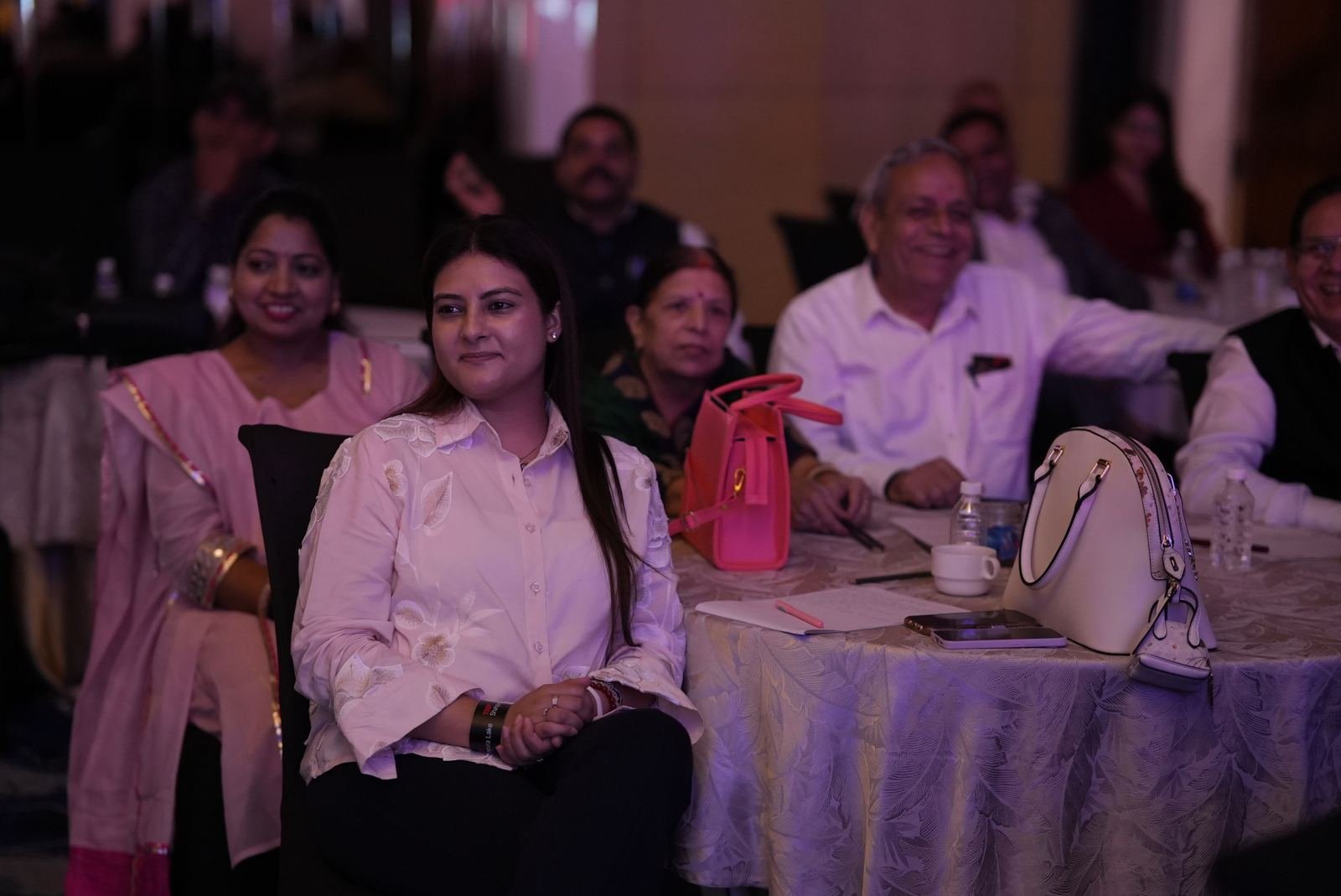 Smiling attendees at their table