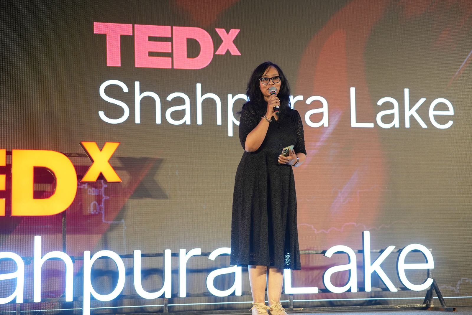 Host on stage at TEDxShahpura Lake 2026